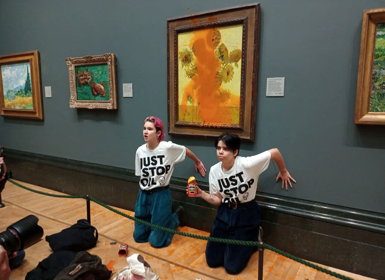 Protesters from Just Stop Oil in front of Van Gogh's Sunflowers